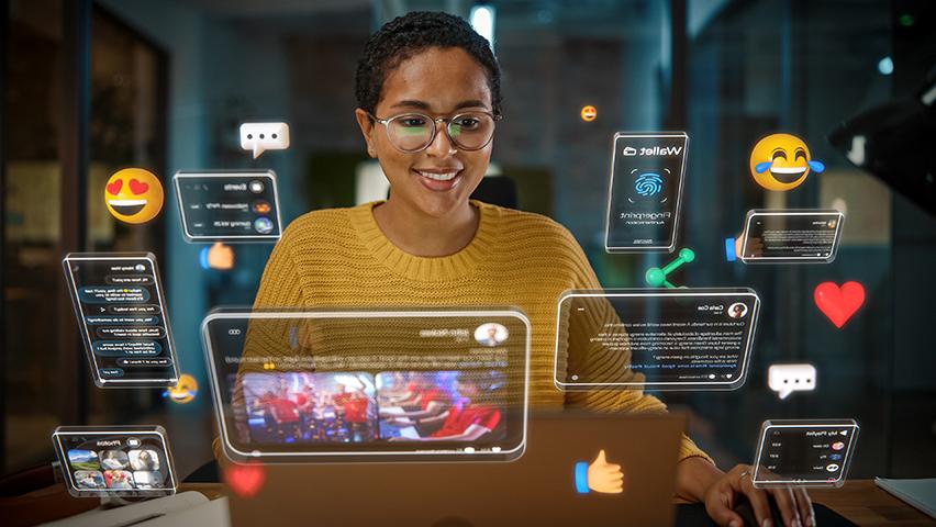 Woman working on computer, social media icons, augmented reality, connectivity.