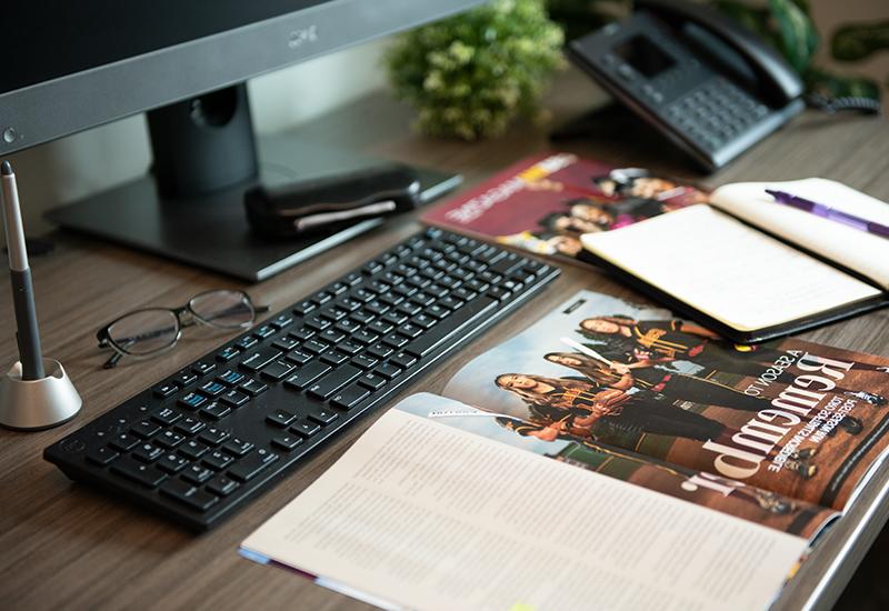 Desk with magazine and notebook