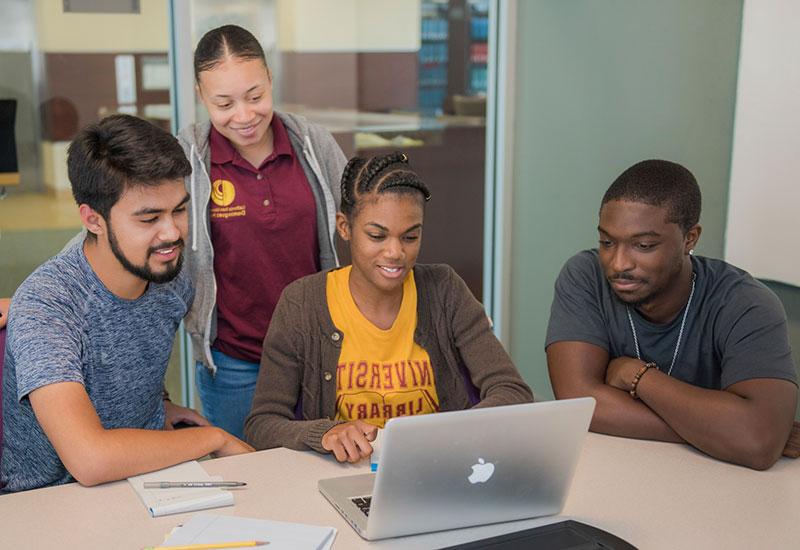 Students viewing a webpage on a computer